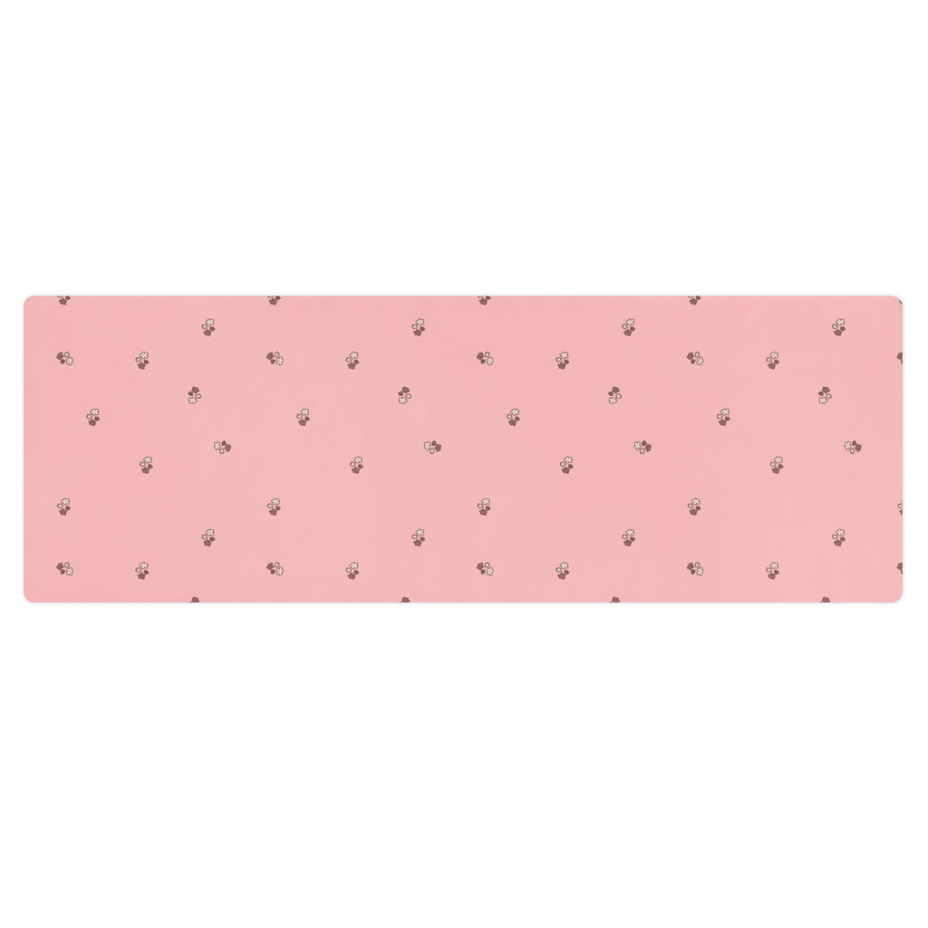 Pale pink yoga mat with small images of flowers.
