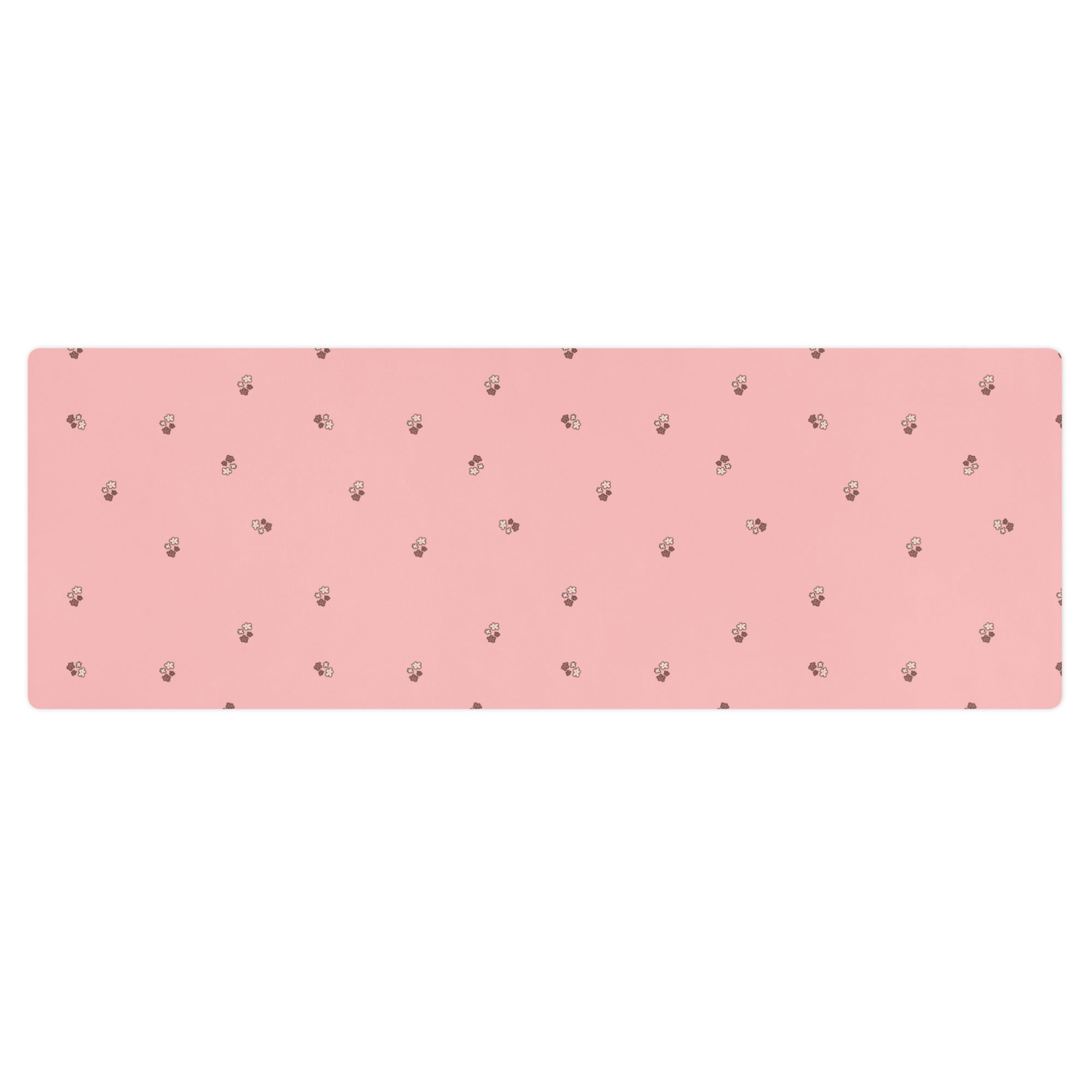Pale pink yoga mat with small images of flowers.