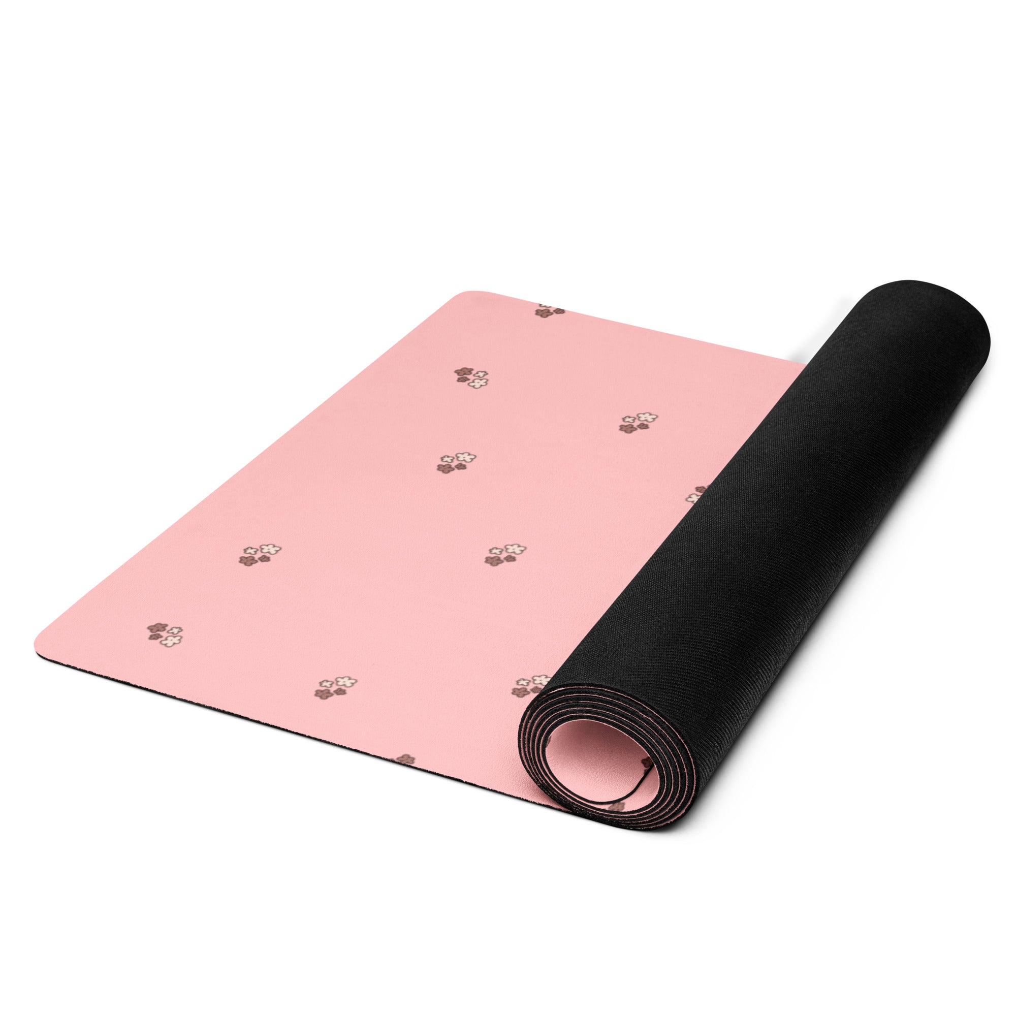 Pale pink yoga mat with small images of flowers.