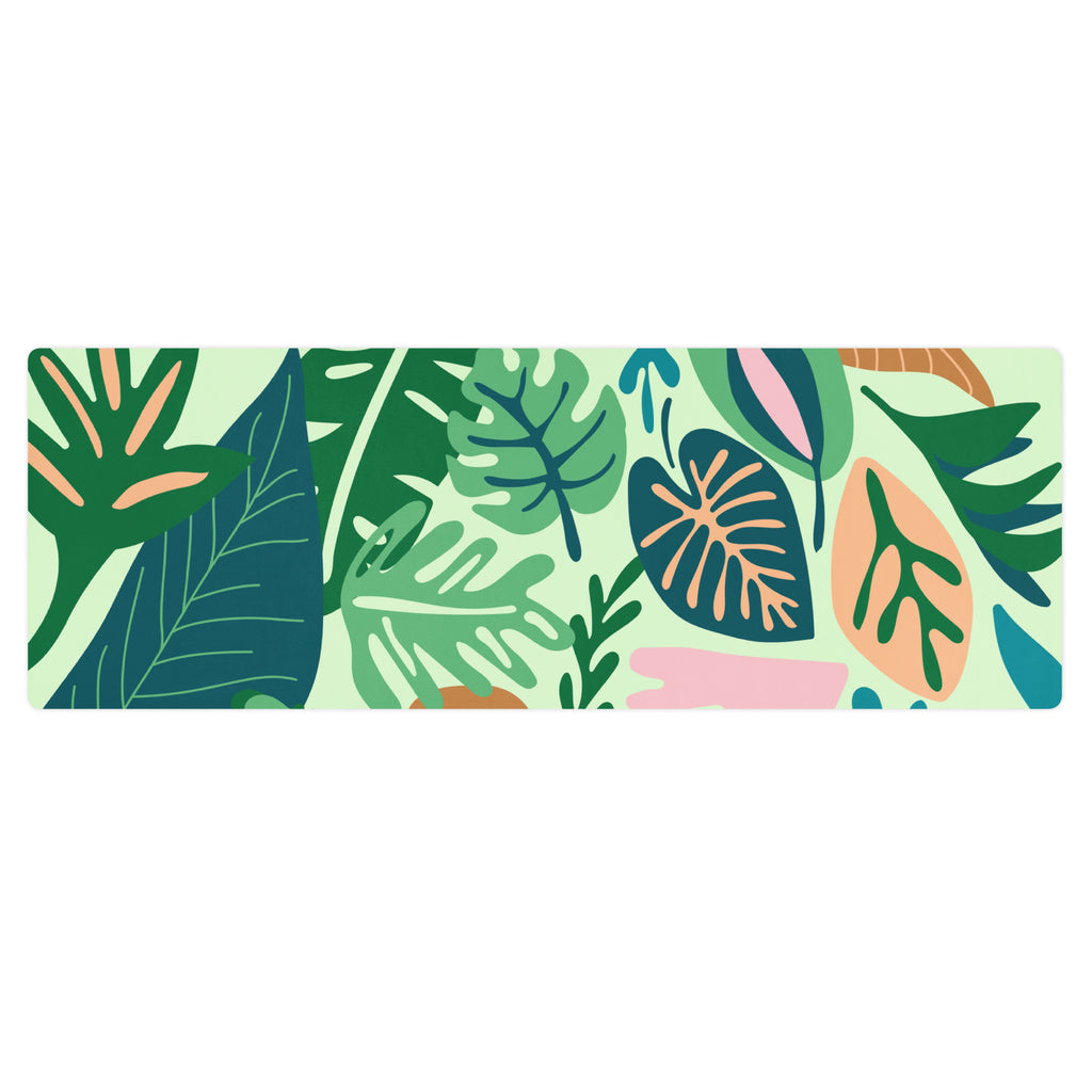 Jungle print/leaf print yoga mat with lots of blue, green, pink tones.
