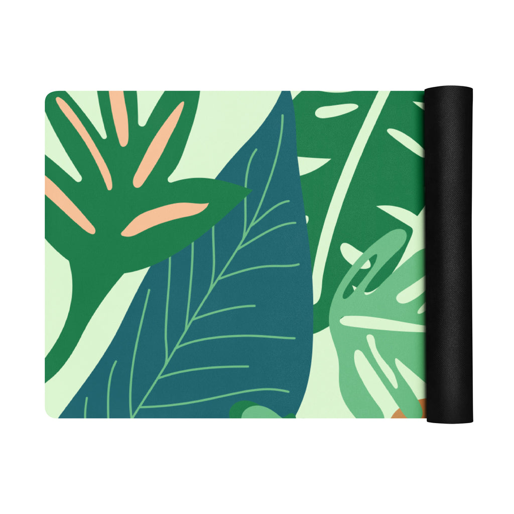 Jungle print/leaf print yoga mat with lots of blue, green, pink tones.