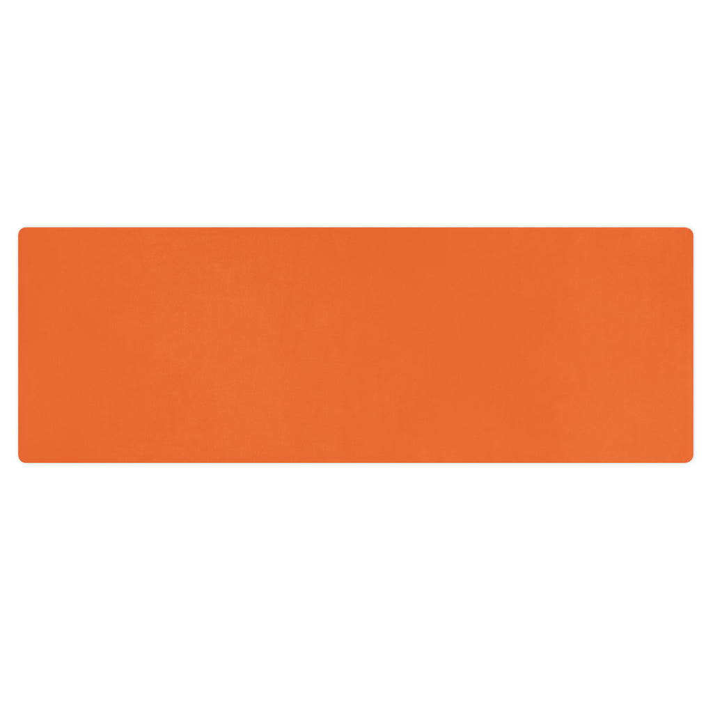 Vibrant orange yoga mat.