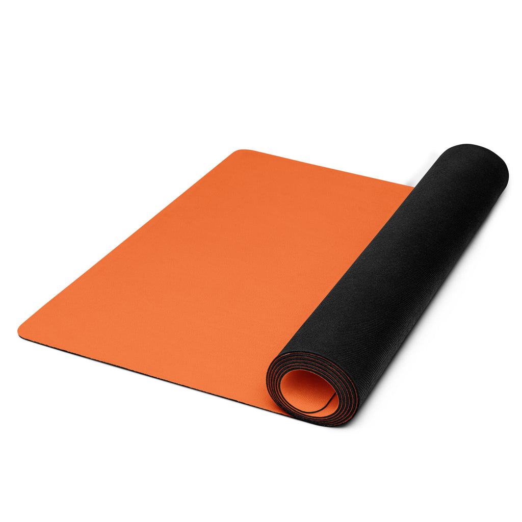 Vibrant orange yoga mat.