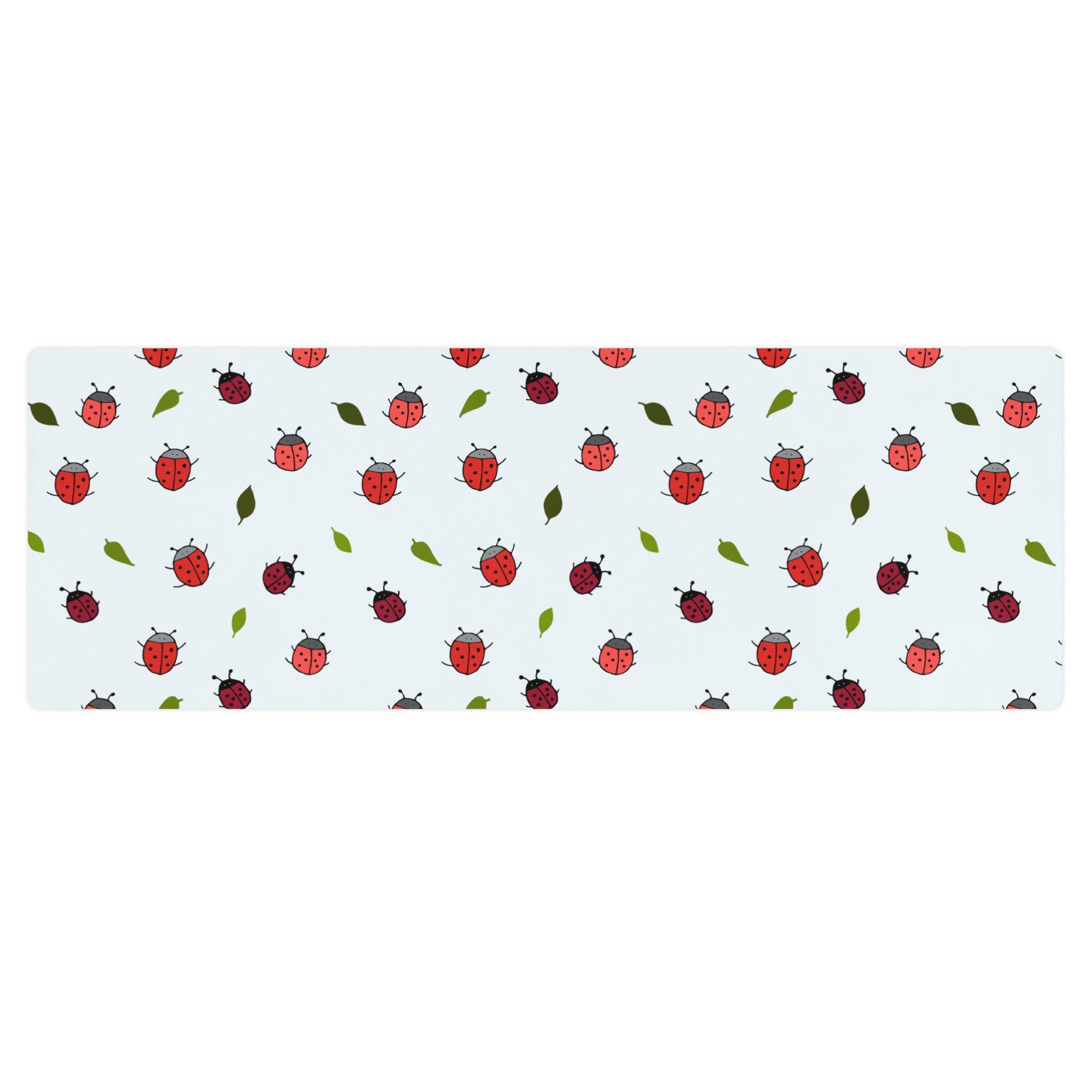 Ladybird print yoga mat on a neutral background. Red ladybirds or ladybugs with green leaves. 