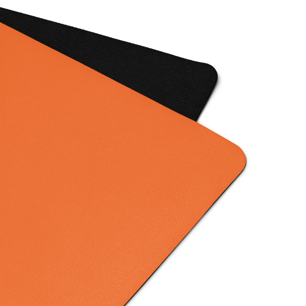 Vibrant orange yoga mat.
